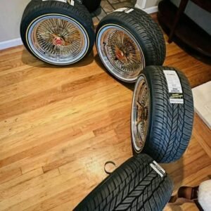 17 Inch Gold And Chrome Wire Wheels With Vogue Tires These wheels are perfect for those who want to upgrade their car's appearance and add a touch of style